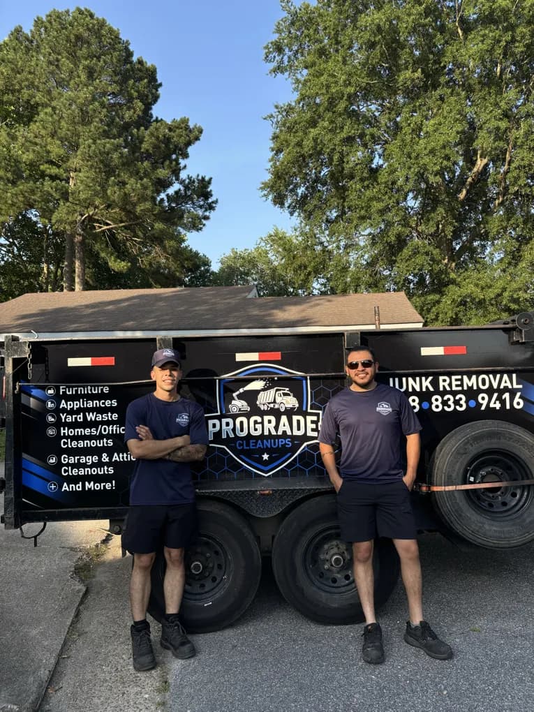 The ProGrade Cleanups crew with their junk removal trailer on a residential street